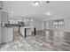 Spacious living area flows into a modern kitchen, showcasing an open layout perfect for entertaining at 2044 Culbreath Rd, Brooksville, FL 34601
