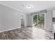 Open living space with sliding glass door access to a backyard deck, blending indoor/outdoor living at 2044 Culbreath Rd, Brooksville, FL 34601