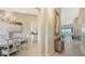 Elegant entryway with ornate mirror and view into living room at 13837 Messina Loop # 204, Bradenton, FL 34211