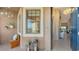 Inviting entryway with a sitting bench and view into the living area at 13837 Messina Loop # 204, Bradenton, FL 34211