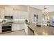 Modern kitchen with granite countertops and stainless steel appliances at 13837 Messina Loop # 204, Bradenton, FL 34211