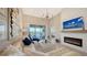 Bright living room features a fireplace, chandelier, and large windows at 13837 Messina Loop # 204, Bradenton, FL 34211