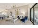 Open living room with chic furnishings and access to the kitchen at 13837 Messina Loop # 204, Bradenton, FL 34211