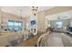 Open living room featuring comfortable seating and a view of the lake at 13837 Messina Loop # 204, Bradenton, FL 34211