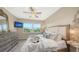 Spacious main bedroom with large windows and a comfortable bed at 13837 Messina Loop # 204, Bradenton, FL 34211