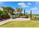 Landscaped patio with seating area overlooking golf course at 13837 Messina Loop # 204, Bradenton, FL 34211