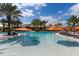Inviting pool with orange umbrellas and plenty of seating at 13837 Messina Loop # 204, Bradenton, FL 34211