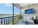 Spacious screened balcony with comfortable seating and lake views at 13837 Messina Loop # 204, Bradenton, FL 34211