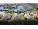 Aerial view of community with lake and homes at 24692 Rio Villa Lakes Cir, Punta Gorda, FL 33950