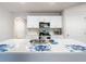 Kitchen with island, white cabinets, and stainless steel appliances at 24692 Rio Villa Lakes Cir, Punta Gorda, FL 33950