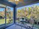 Relaxing screened lanai with table and chairs at 24692 Rio Villa Lakes Cir, Punta Gorda, FL 33950