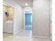 Bright laundry room with washer, dryer, and shelving at 24692 Rio Villa Lakes Cir, Punta Gorda, FL 33950