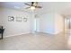 Bright living room with tile floors and ceiling fan at 24692 Rio Villa Lakes Cir, Punta Gorda, FL 33950