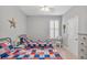 Bedroom with twin beds and red, white, and blue bedding at 813 Old Windsor Way, Spring Hill, FL 34609