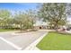 Community clubhouse entrance with landscaping at 813 Old Windsor Way, Spring Hill, FL 34609