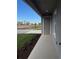 Covered back porch with gray door and view of surrounding area at 9019 Rothman Ln, Lakewood Ranch, FL 34240