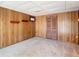 Finished basement with wood paneling and carpet at 8701 Gulf Blvd, St Pete Beach, FL 33706