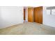 Simple bedroom with carpet and double closets at 8701 Gulf Blvd, St Pete Beach, FL 33706