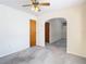 Simple bedroom with wood door and carpet at 8701 Gulf Blvd, St Pete Beach, FL 33706