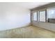 Bedroom featuring three windows and carpet at 8701 Gulf Blvd, St Pete Beach, FL 33706