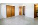 Simple bedroom with double doors and terrazzo flooring at 8701 Gulf Blvd, St Pete Beach, FL 33706