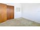 Bedroom with carpet and double door closet at 8701 Gulf Blvd, St Pete Beach, FL 33706