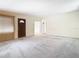 Bright living room featuring neutral colored walls and carpeted floors at 8701 Gulf Blvd, St Pete Beach, FL 33706