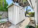 White metal storage shed in backyard at 8701 Gulf Blvd, St Pete Beach, FL 33706