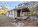 Rustic wooden deck extending from the back of the house at 11317 Salina St, Brooksville, FL 34614