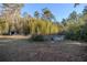 Landscaped garden with raised planters and fencing at 11317 Salina St, Brooksville, FL 34614