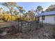 Raised garden beds enclosed by a metal fence at 11317 Salina St, Brooksville, FL 34614