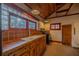 Rustic kitchen with wood cabinets and unique block windows at 11317 Salina St, Brooksville, FL 34614