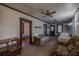 Bright living room with hardwood floors and vintage furniture at 11317 Salina St, Brooksville, FL 34614