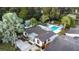 Aerial view showing home, pool, and lush landscaping at 1212 59Th S St, Gulfport, FL 33707