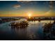 Aerial view of a calm bay with a boat passing by at 1700 Curry Trl # 35, North Venice, FL 34275