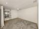 Simple bedroom with gray carpeting, ceiling fan, and window with curtains at 1700 Curry Trl # 35, North Venice, FL 34275