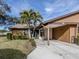 Tan house with brown roof and carport at 1700 Curry Trl # 35, Nokomis, FL 34275