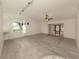 Bright living room featuring light gray vinyl flooring and a view to backyard at 1700 Curry Trl # 35, North Venice, FL 34275