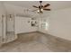 Living room with wood-look floors and access to kitchen at 1700 Curry Trl # 35, North Venice, FL 34275