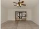 Spacious living room with wood-look floors and access to sunroom at 1700 Curry Trl # 35, Nokomis, FL 34275