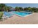 Another view of the community pool and lounge chairs at 1700 Curry Trl # 35, North Venice, FL 34275