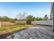Spacious backyard with open views and a paver patio at 10710 Southern Forest Dr, Riverview, FL 33578