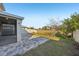 Large backyard with paver patio and screened porch at 10710 Southern Forest Dr, Riverview, FL 33578