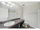 Bathroom with single vanity, toilet, and dark brown cabinets at 10710 Southern Forest Dr, Riverview, FL 33578