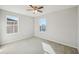 Bedroom with ceiling fan, carpet, and two windows at 10710 Southern Forest Dr, Riverview, FL 33578
