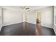 Spacious bedroom with dark hardwood floors and ceiling fan at 10710 Southern Forest Dr, Riverview, FL 33578