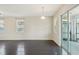Bright dining room features dark hardwood floors and sliding glass doors to patio at 10710 Southern Forest Dr, Riverview, FL 33578