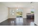 Bright dining room, hardwood floors, and access to screened patio at 10710 Southern Forest Dr, Riverview, FL 33578