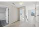 Upstairs hallway with carpet and doors to bedrooms and bathroom at 10710 Southern Forest Dr, Riverview, FL 33578