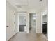 Upstairs hallway with carpet and doors to bedrooms and bathroom at 10710 Southern Forest Dr, Riverview, FL 33578